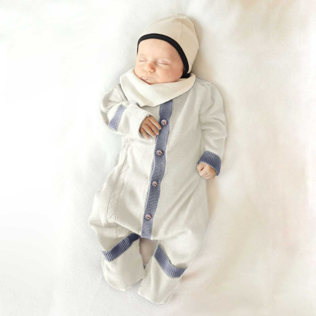 Organic cotton newborn baby romper with cable knit details, foldable cuffs, and natural coconut buttons — view 4