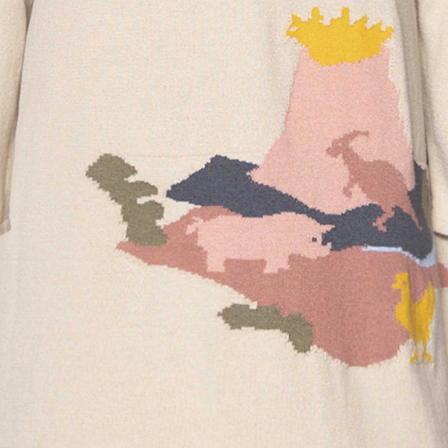 Beige knitted dress for girls made of organic cotton featuring a fun animal and dinosaur print — view 3