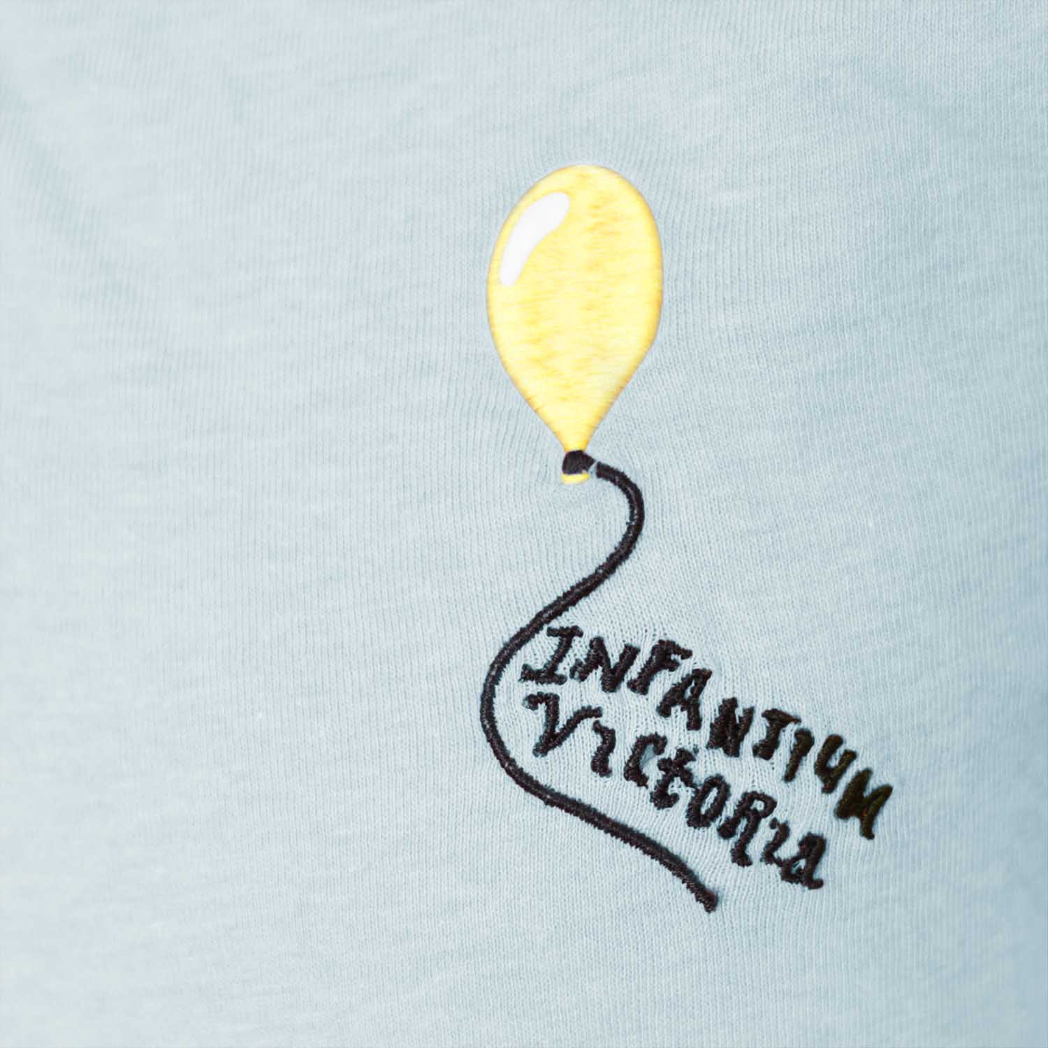 Mint green organic cotton kids polo shirt with coconut buttons and pocket balloon embroidery — view 4
