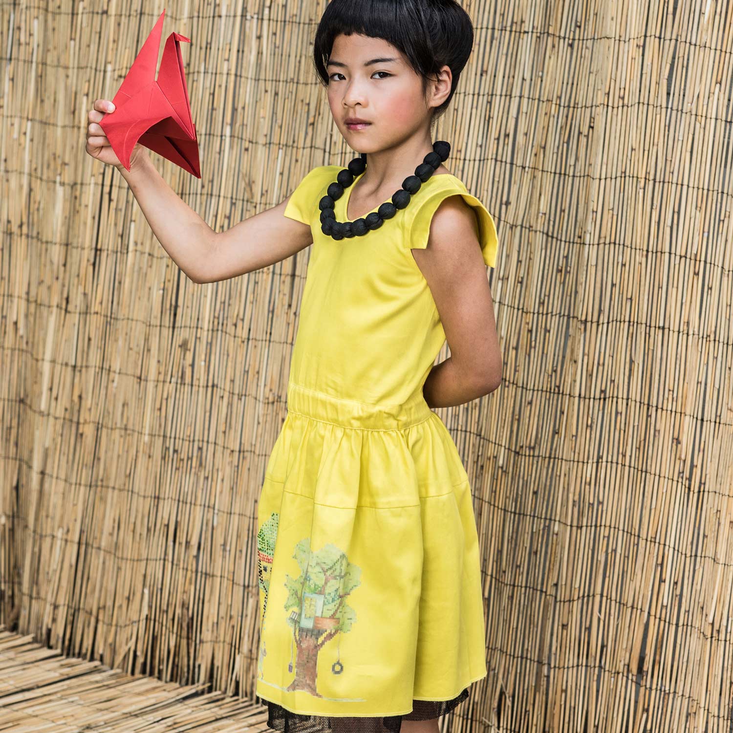 Yellow embroidered dress for girls made of organic cotton featuring a handcrafted treehouse print — view 2