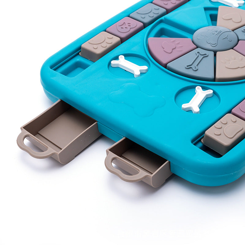 Interactive dog food dispenser toy in blue plastic with sliding puzzle panels and treat compartments — view 4