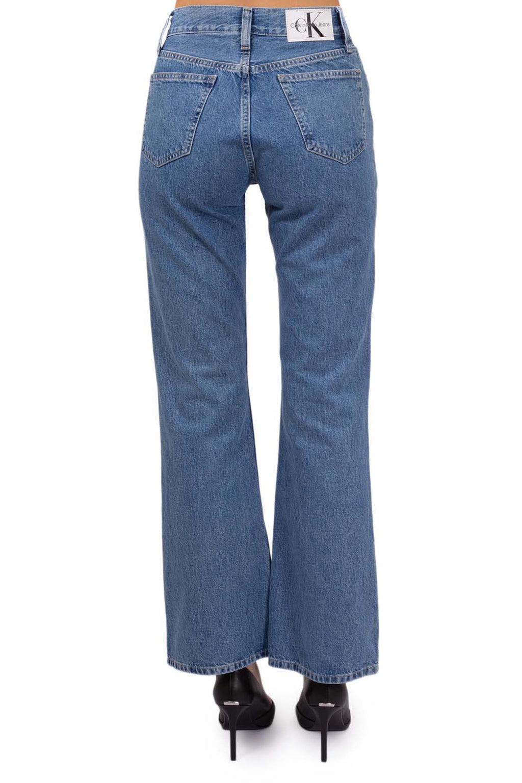 Women's medium-light wash bootcut jeans with five pocket design and logo details — view 7