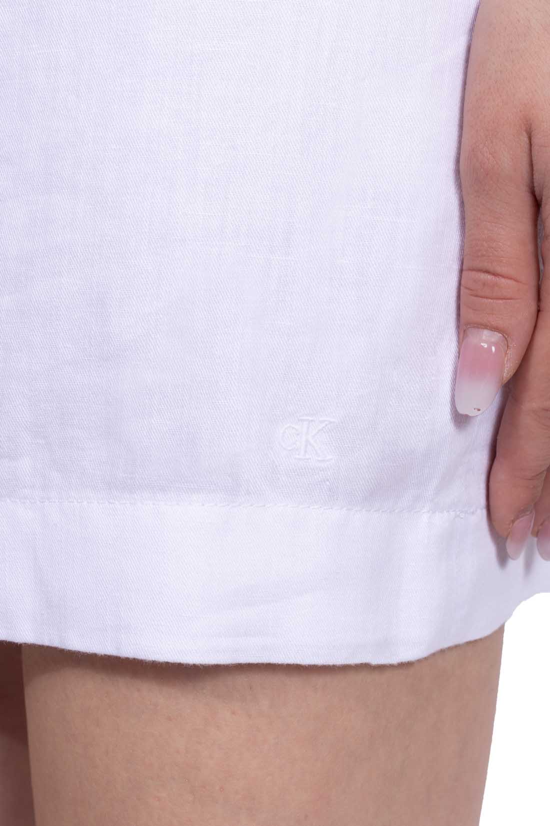 White cotton linen blend short dress with square neckline and A-line flared silhouette.
