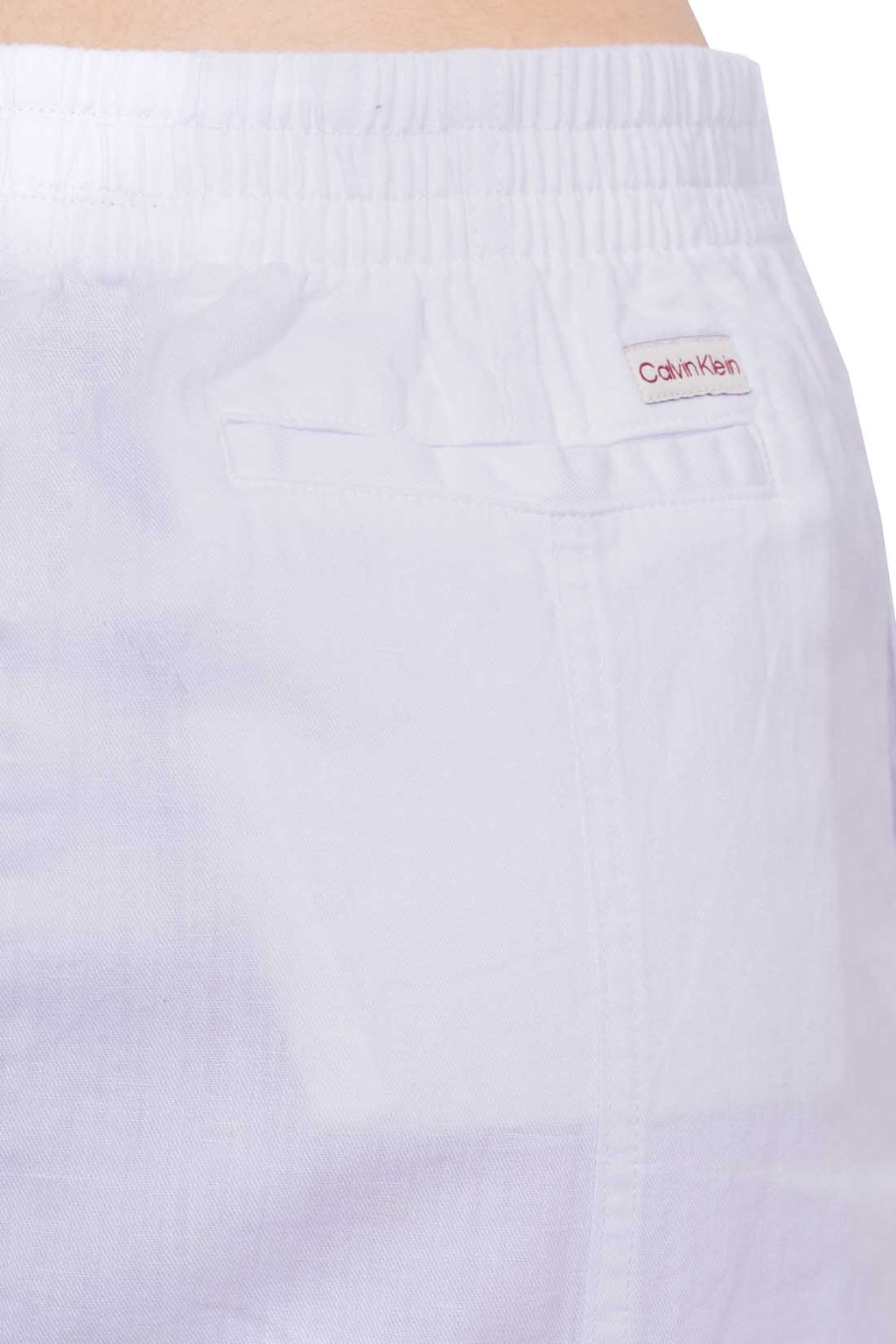 White women's midi skirt in cotton linen twill with front slit and elastic waist.