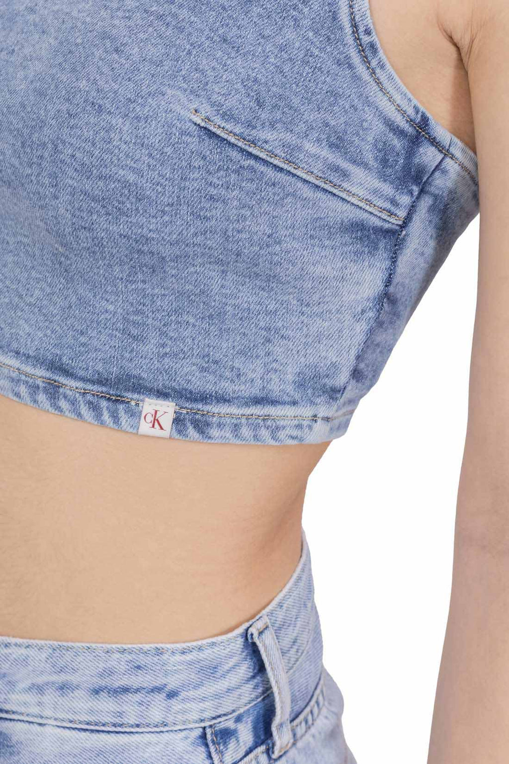 Women's light wash denim bralette crop top with thin straps and back zipper fastening — view 5