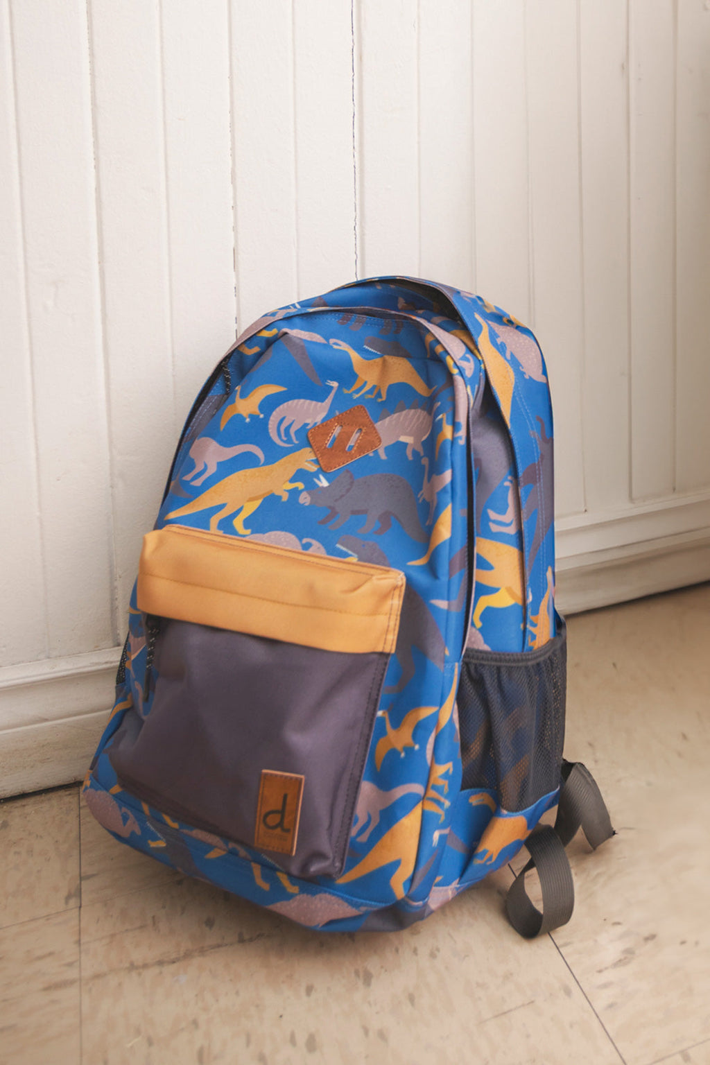 Kids backpack featuring blue dinosaur print padded straps and water bottle pocket in recycled polyester — view 3