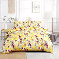 Sunshine yellow floral duvet cover set with hummingbird pattern and matching pillowcases.