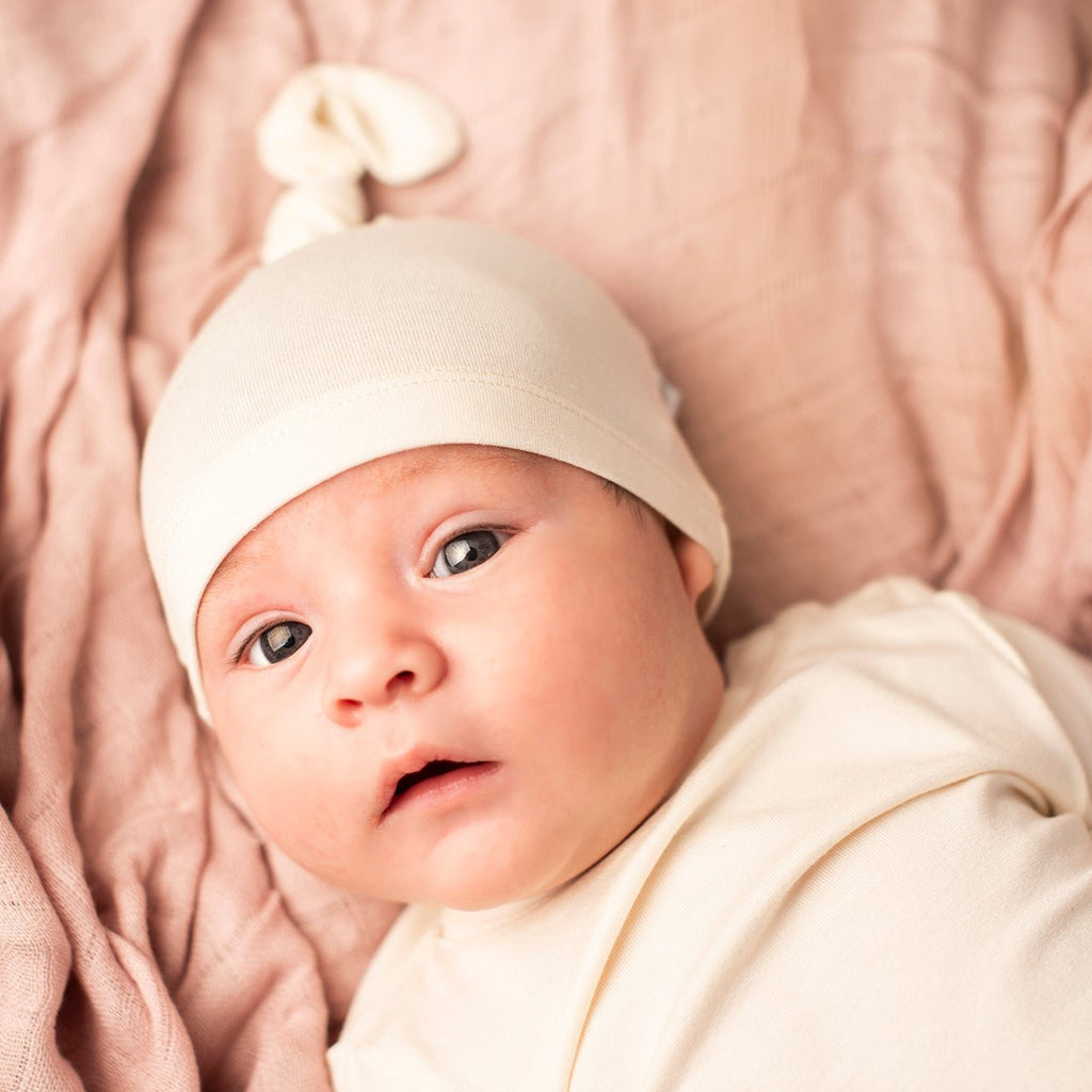 Cream bamboo baby beanie, soft and breathable hypoallergenic headwear for infants and toddlers. — view 2