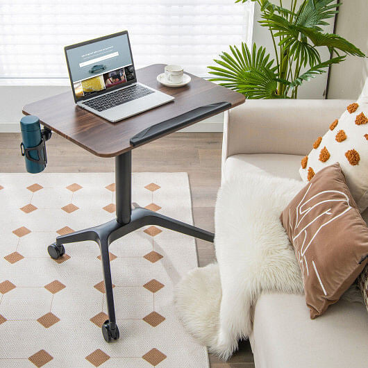 Pneumatic standing desk with an adjustable tilting top, lockable wheels, and a side cup holder
