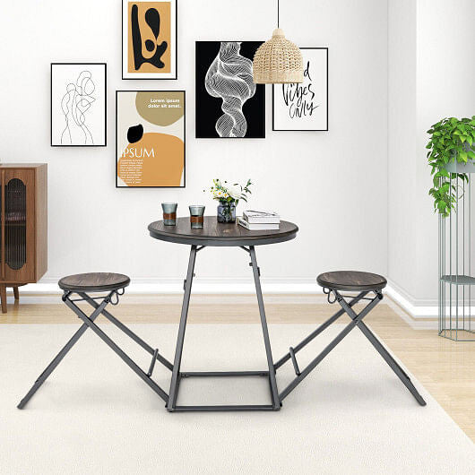 Three piece gray round dining table set with two foldable stools stored underneath — view 2