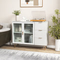 Modern white sideboard buffet cabinet with gold metal legs, glass doors, and three storage drawers