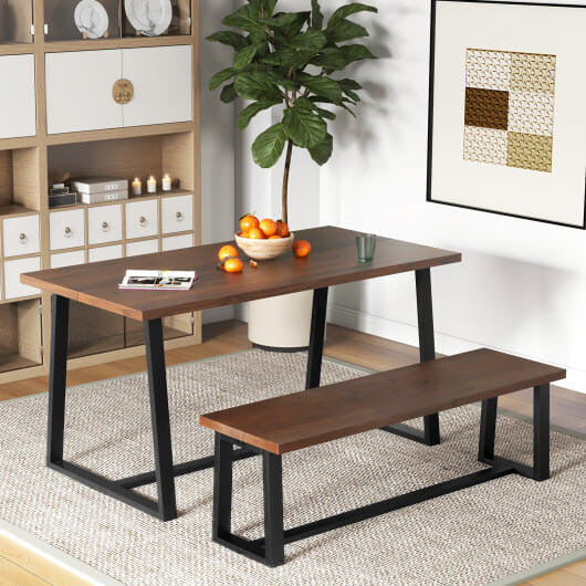 Rustic acacia wood dining bench with black metal frame and adjustable footpads for indoor seating.
