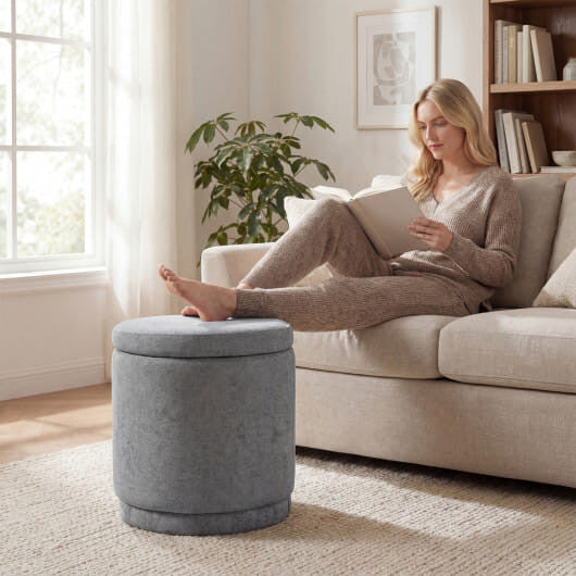 Round storage ottoman in gray chenille fabric with removable lid and solid acacia wood base