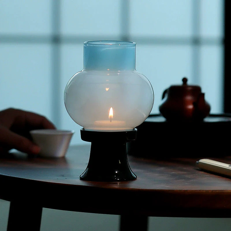 Hand-blown heat-resistant glass aroma candle lamp with a sleek black ceramic base — view 4