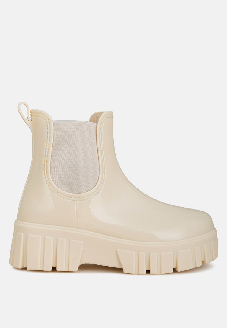 Chunky synthetic leather Chelsea boots with platform block heels, elastic gussets, and thick lug soles