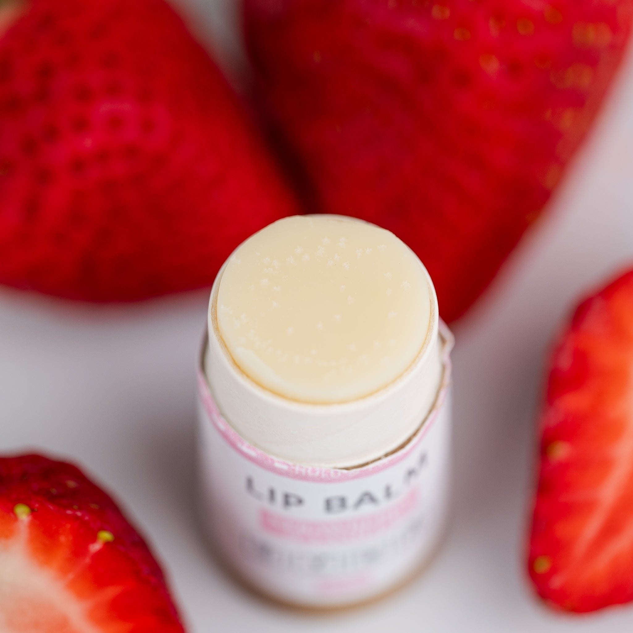 Organic hydrating lip balm in eco-friendly cardboard tube with coconut oil and shea butter — view 2