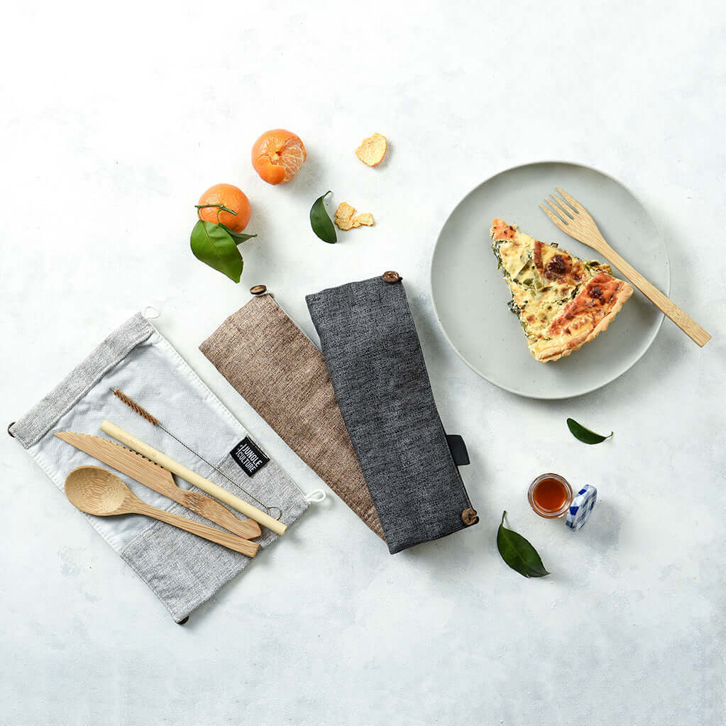 Bamboo travel cutlery set with green pouch, including a wooden fork, knife, spoon, and straw — view 5