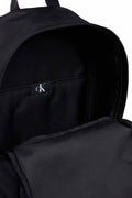 Black Calvin Klein Men's recycled nylon backpack with front zip pocket and padded shoulder straps