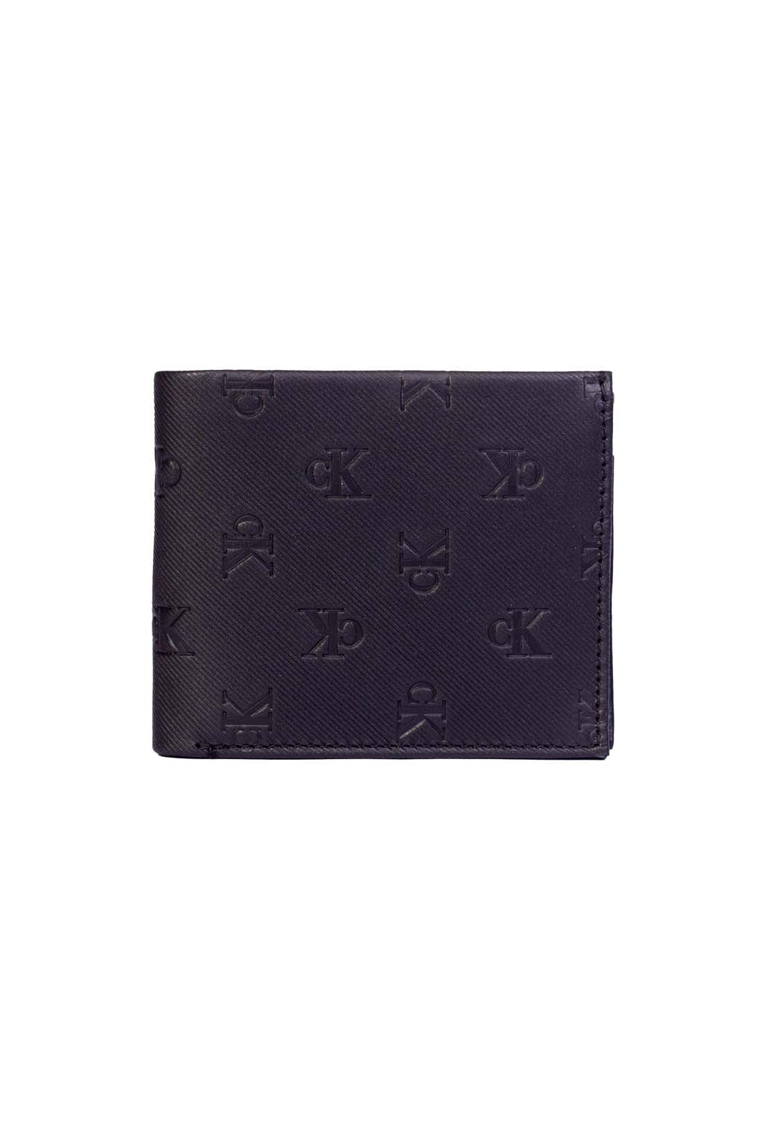 Men's black leather bifold wallet with all-over embossed monogram and knurled finish. — view 4