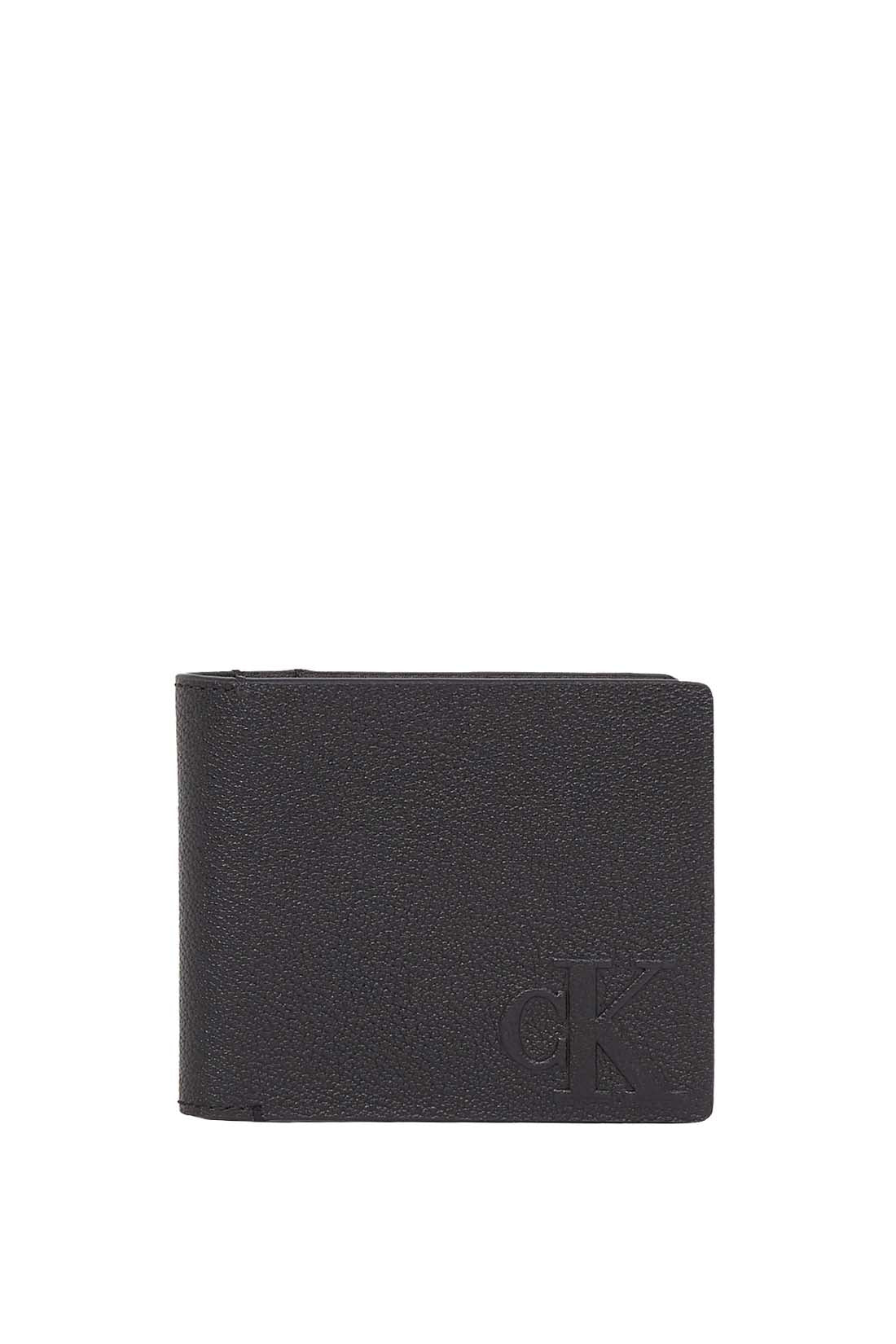 Men's bifold wallet in grained black leather with interior compartments and signature embossed monogram logo. — view 4