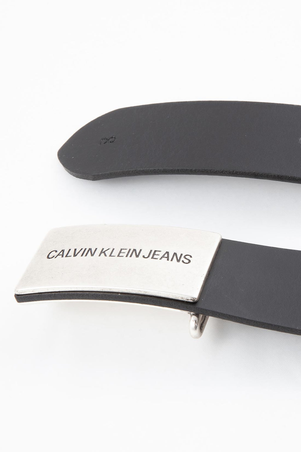 Women's black genuine leather belt featuring a silver metal logo plaque and snap closure. — view 8