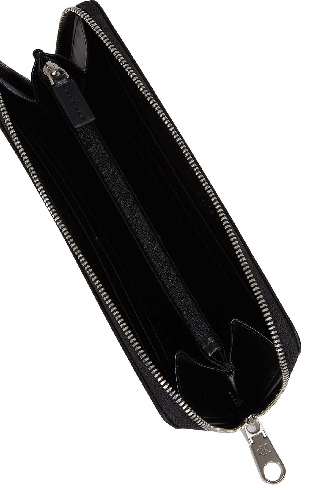 Women's zip-around wallet in smooth black faux-leather with Calvin Klein linear logo — view 2