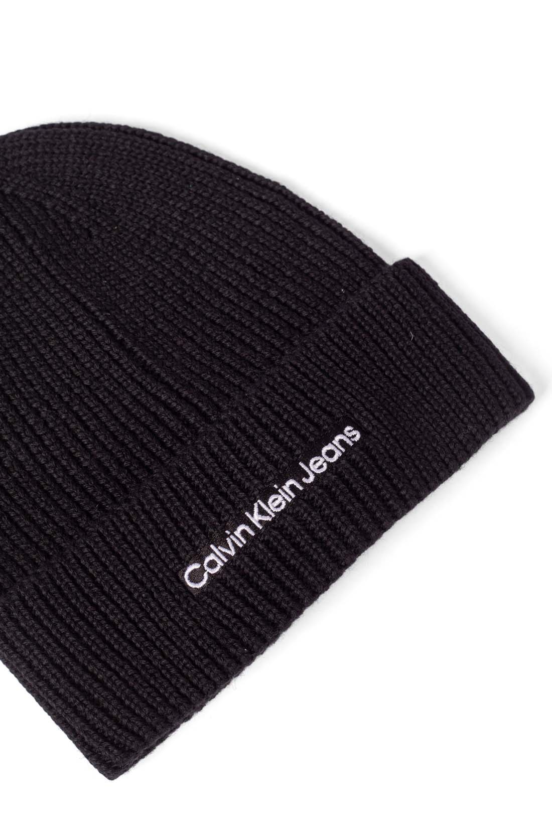 Women's black ribbed wool blend beanie with front embroidered logo and turn-up cuff — view 4