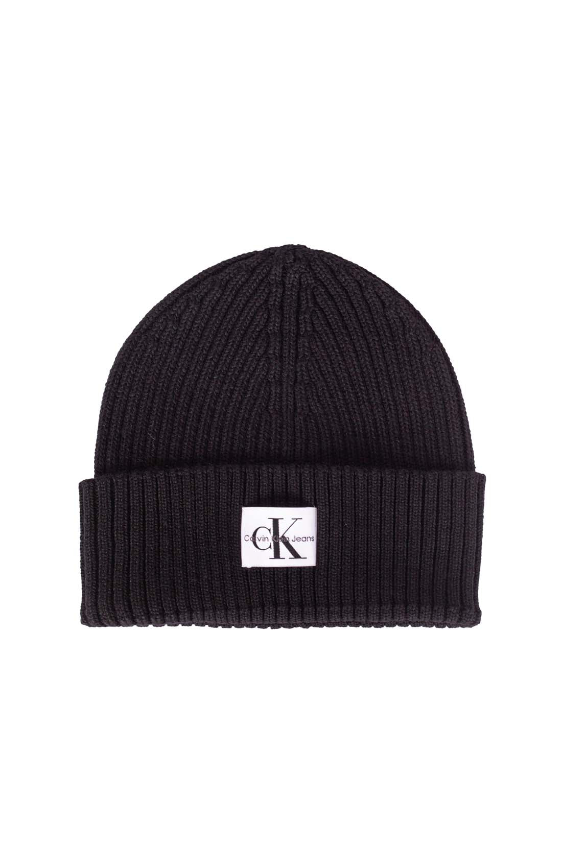 Black ribbed wool blend women's beanie with an adjustable turn-up and signature front logo patch — view 3