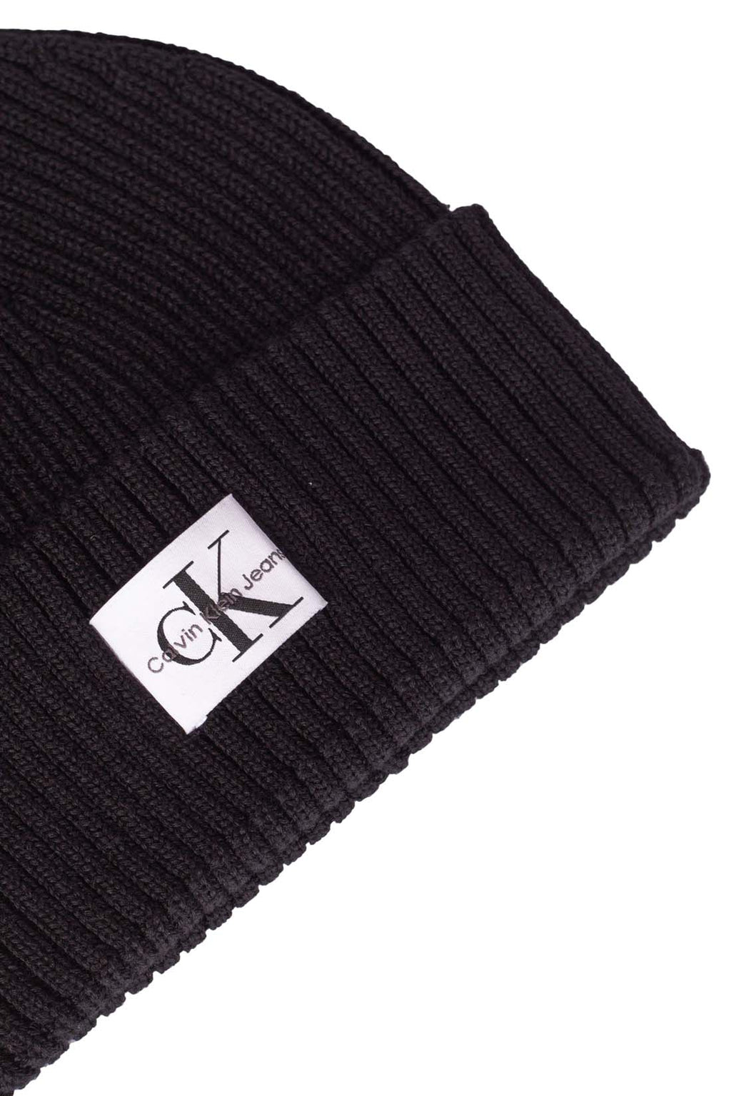 Black ribbed wool blend women's beanie with an adjustable turn-up and signature front logo patch — view 2