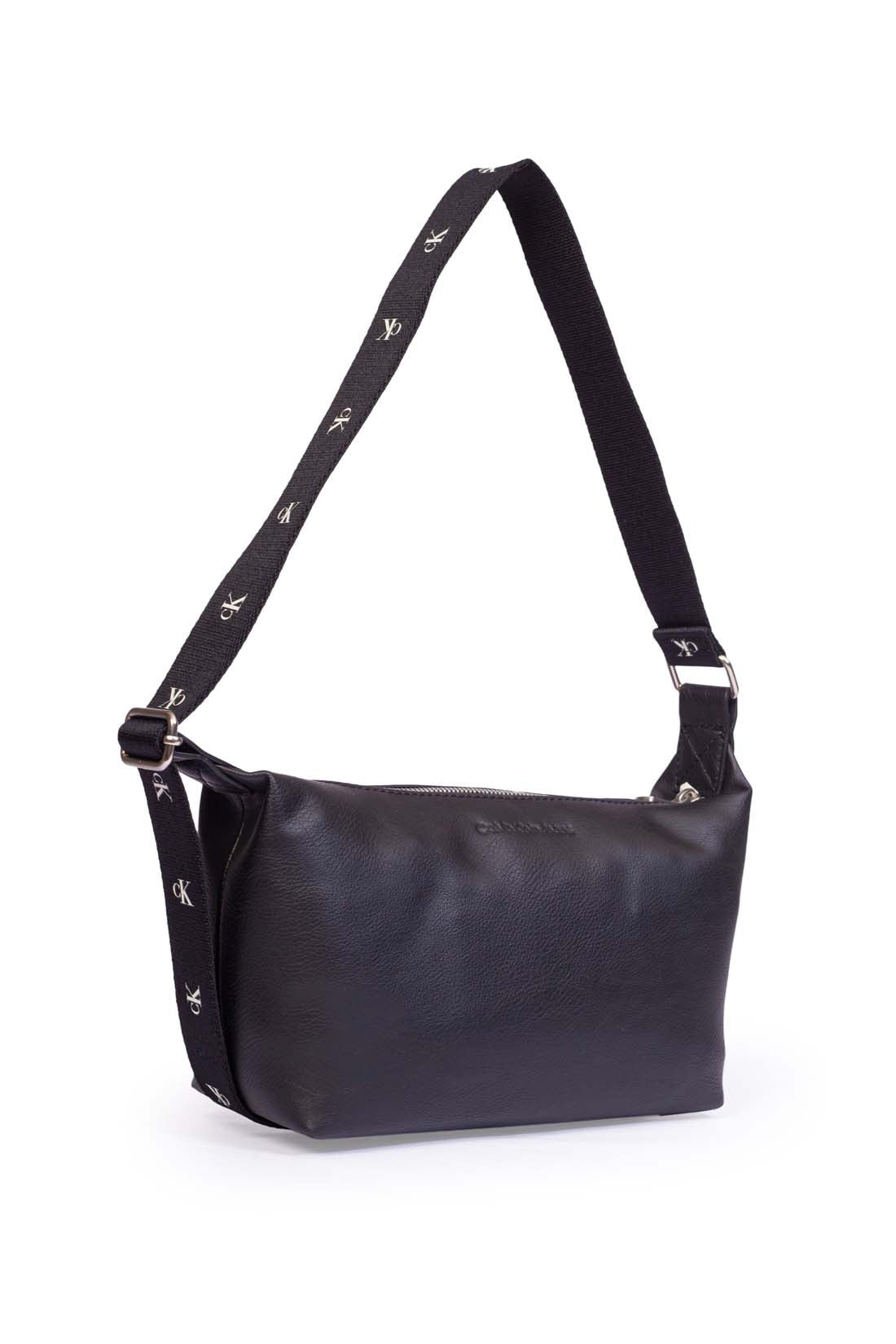 Black faux leather Calvin Klein shoulder bag with adjustable printed monogram strap and logo details — view 3