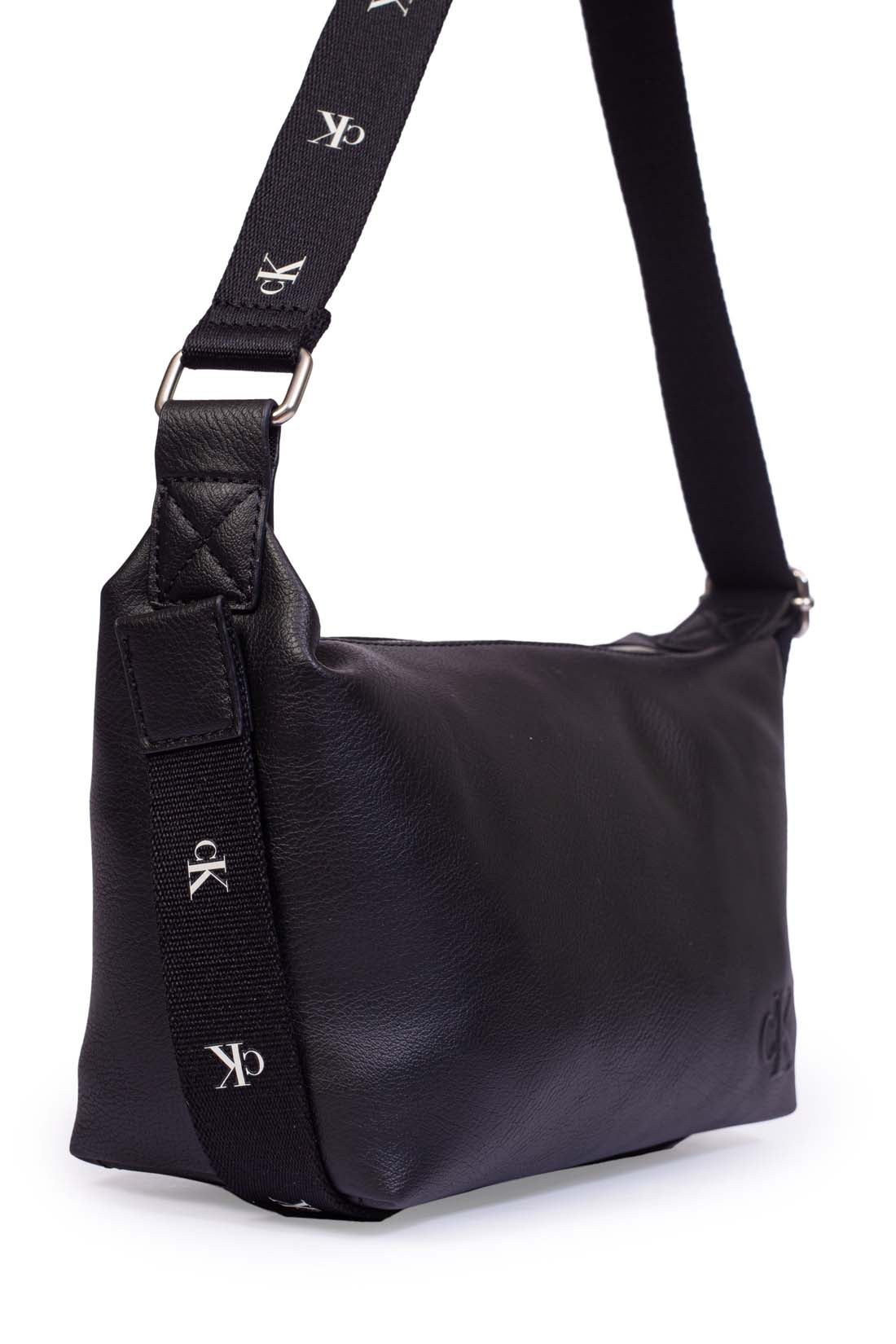 Black faux leather Calvin Klein shoulder bag with adjustable printed monogram strap and logo details — view 7