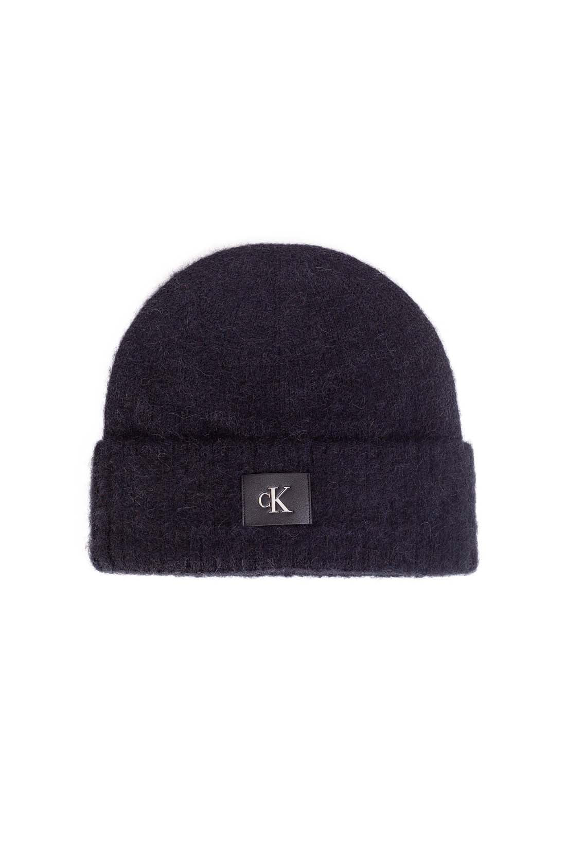 Women's purple alpaca wool blend beanie with adjustable turn-up cuff and front monogram patch — view 6