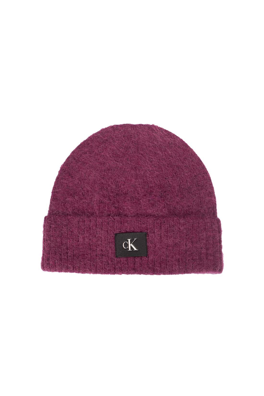 Women's purple alpaca wool blend beanie with adjustable turn-up cuff and front monogram patch — view 9