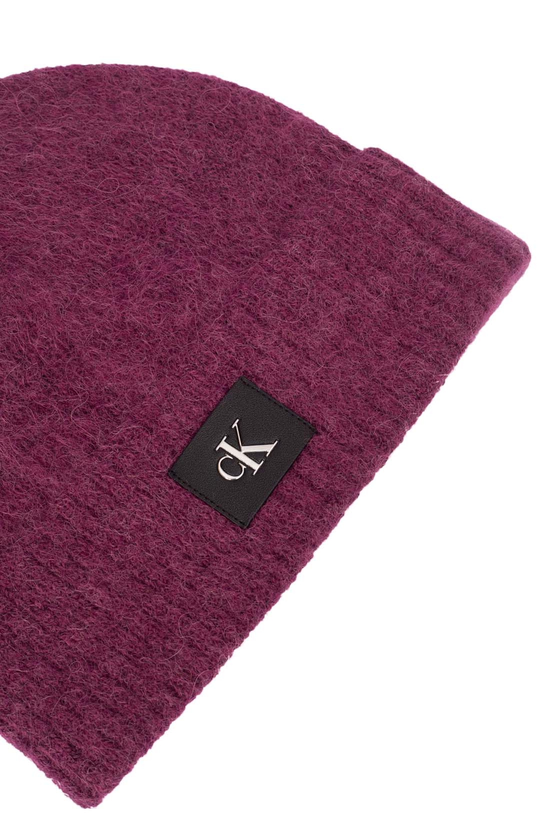 Women's purple alpaca wool blend beanie with adjustable turn-up cuff and front monogram patch — view 8