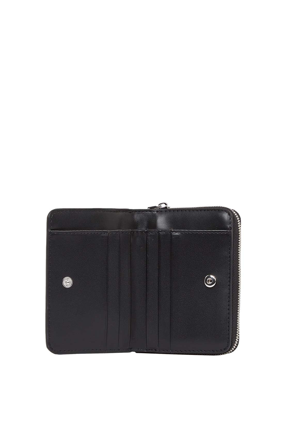 Black faux-leather women's small wallet with front monogram plaque and secure snap closure. — view 2