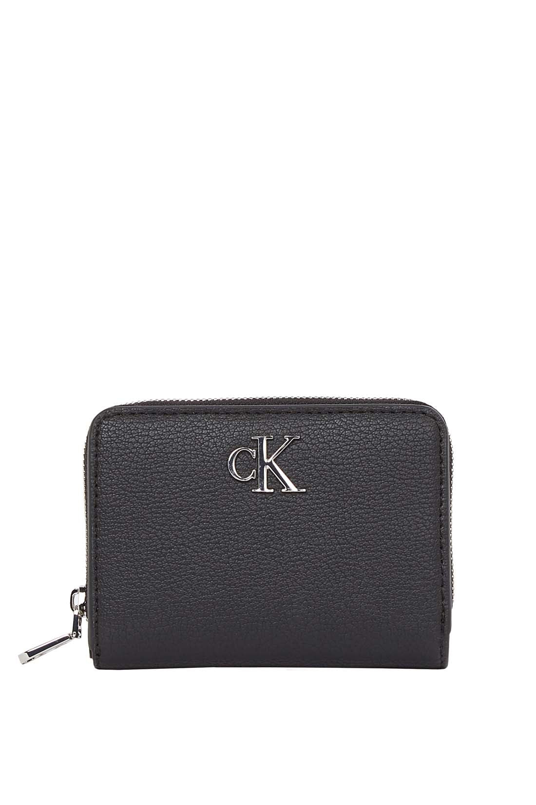 Black faux-leather women's small wallet with front monogram plaque and secure snap closure. — view 8