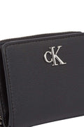 Black faux-leather women's small wallet with front monogram plaque and secure snap closure.
