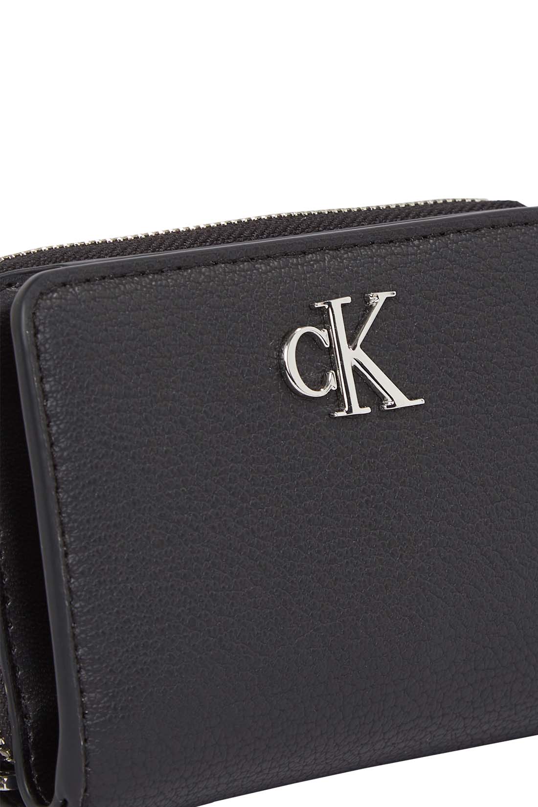 Black faux-leather women's small wallet with front monogram plaque and secure snap closure. — view 5