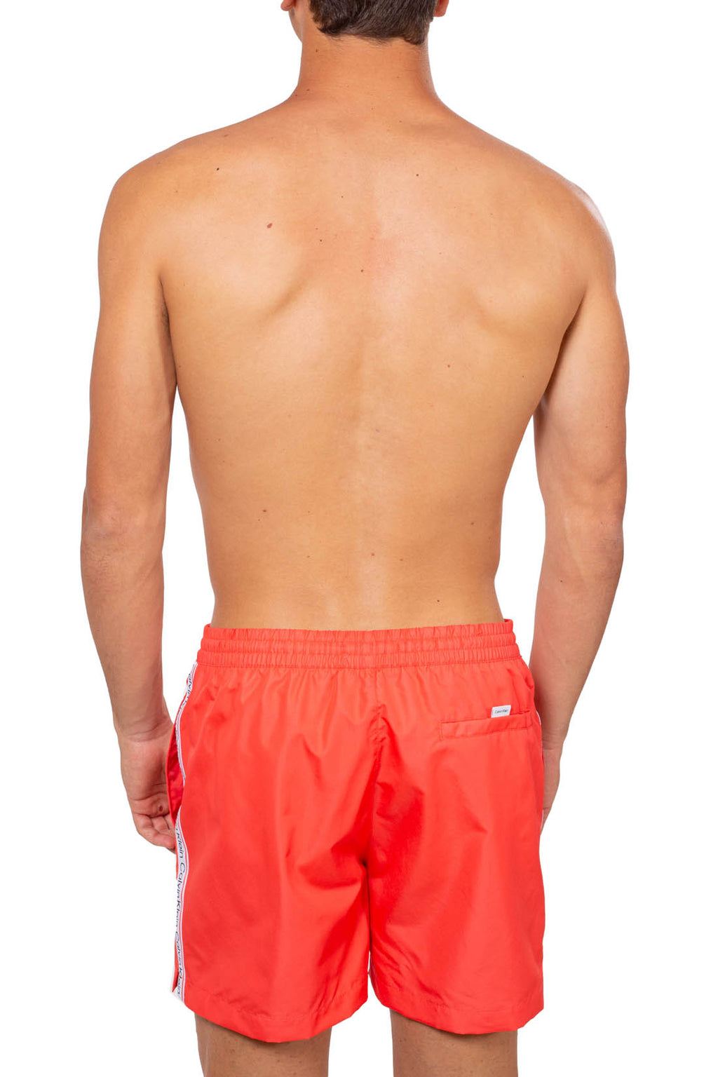 Men's basic swim shorts in coral pink with contrast side logo taping and white drawstring — view 3