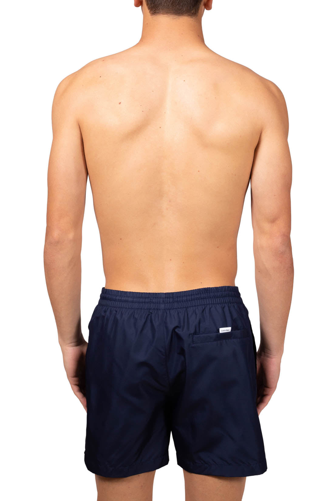 Blue Calvin Klein men's swim shorts with elastic waistband, drawstring, and white patch logo. — view 11