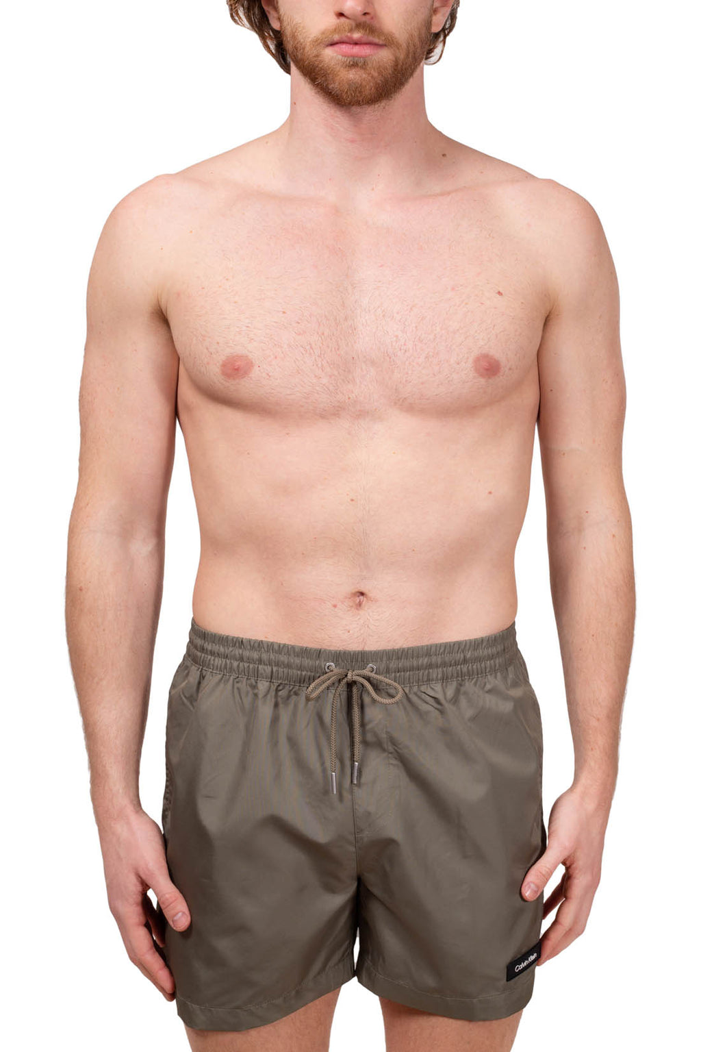 Blue Calvin Klein men's swim shorts with elastic waistband, drawstring, and white patch logo. — view 2
