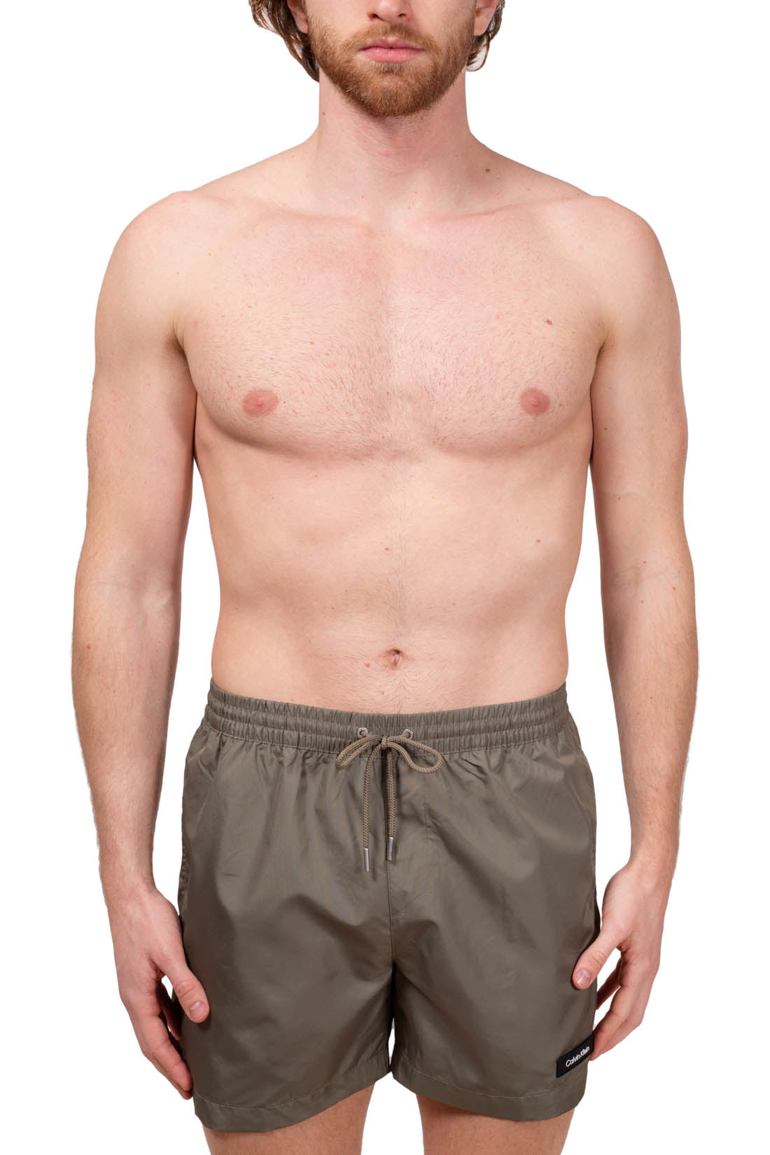 Blue Calvin Klein men's swim shorts with elastic waistband, drawstring, and white patch logo. — view 2