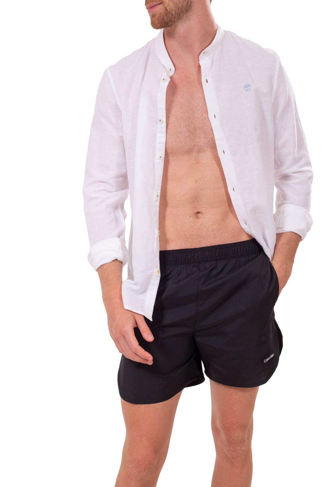 Olive green men's swim shorts with black drawstring and front logo patch in recycled polyester — view 4