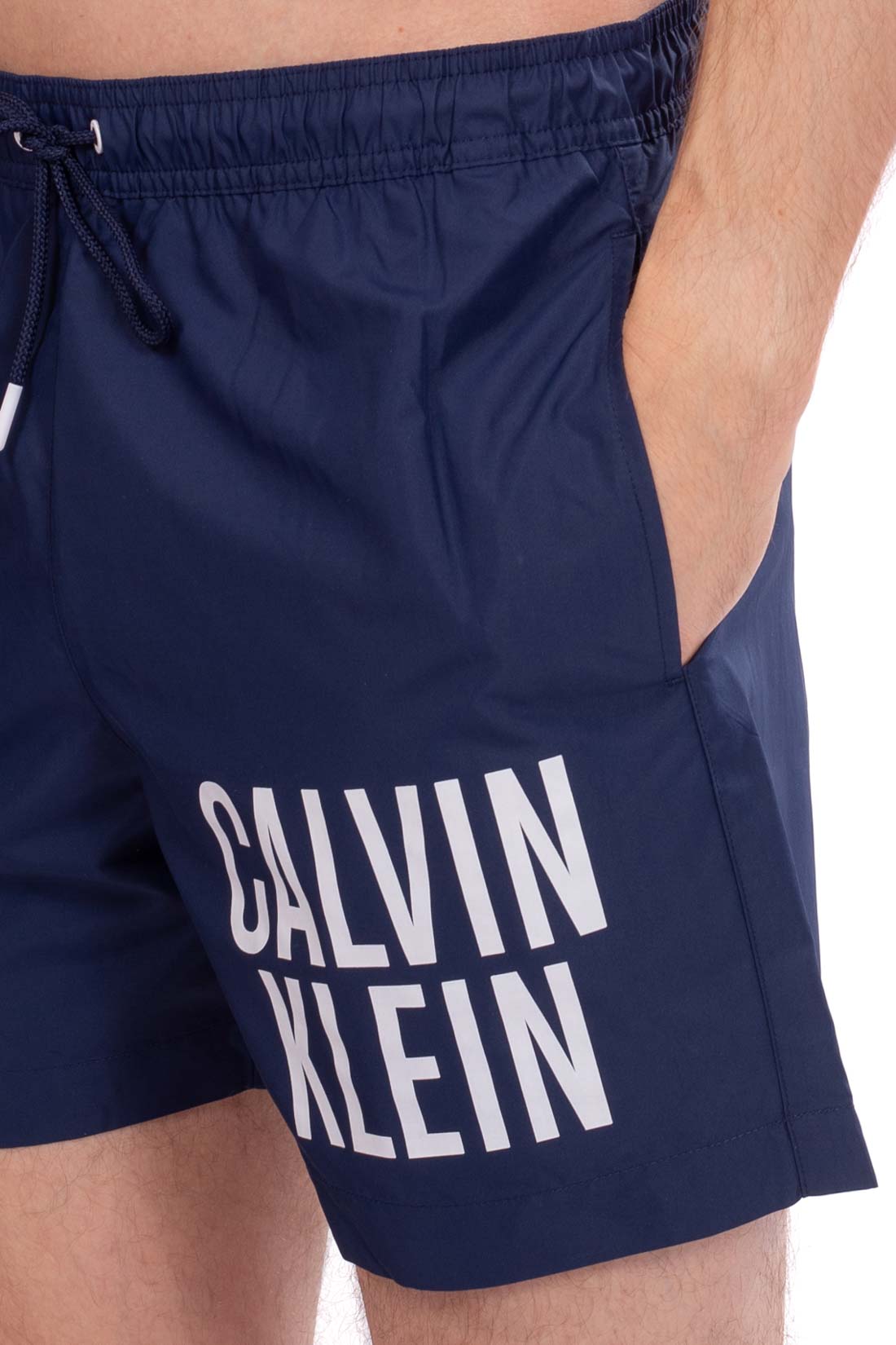 Navy blue men's swim shorts with bold printed logo, elasticated drawstring waistband, and regular fit. — view 9