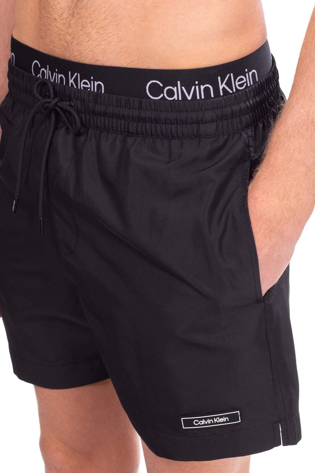 Calvin Klein men's swim shorts in blue nylon with contrast logo elasticated waistband