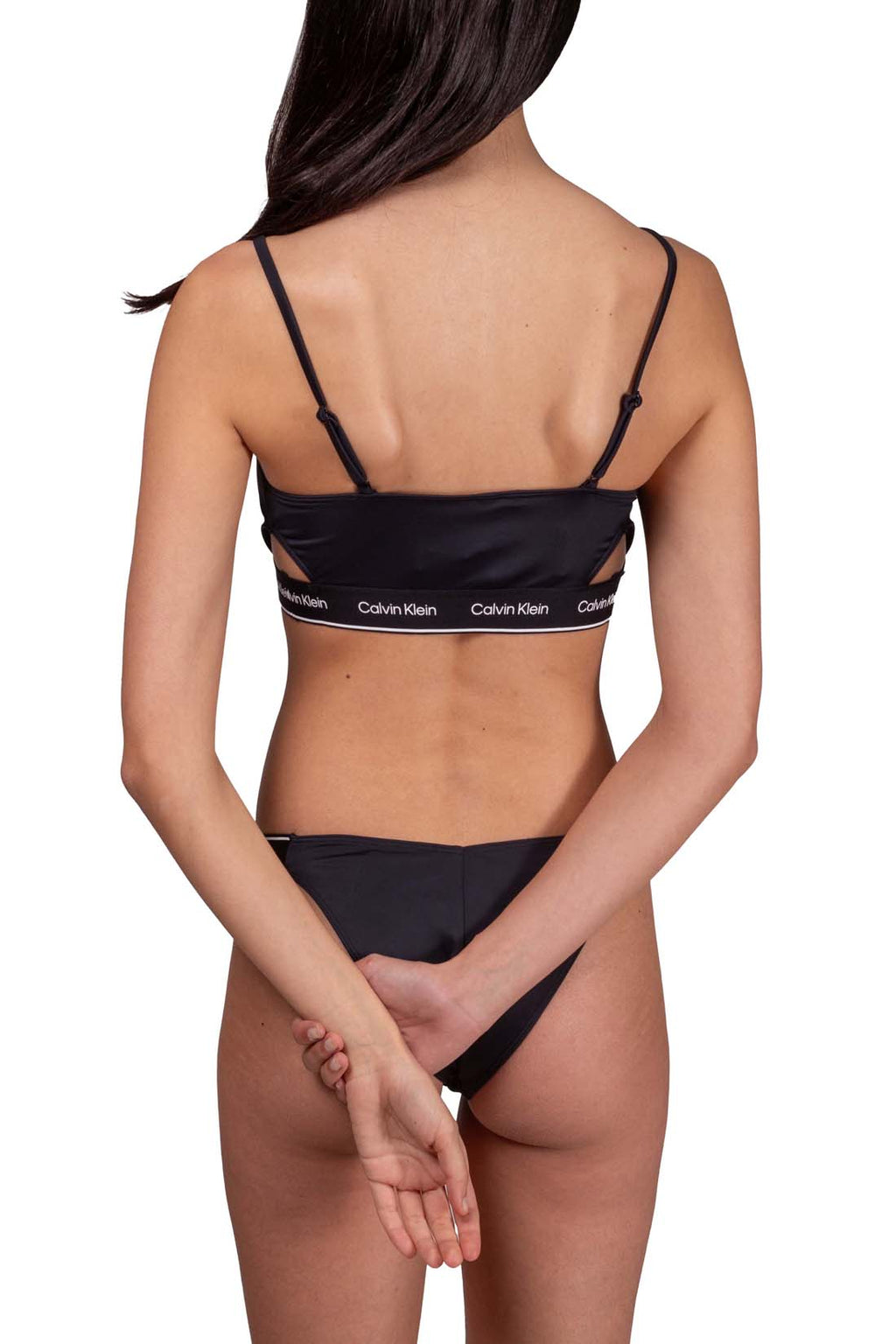 White bandeau bikini top with side cut-outs, adjustable straps, and printed contrasting logo underbust band — view 13