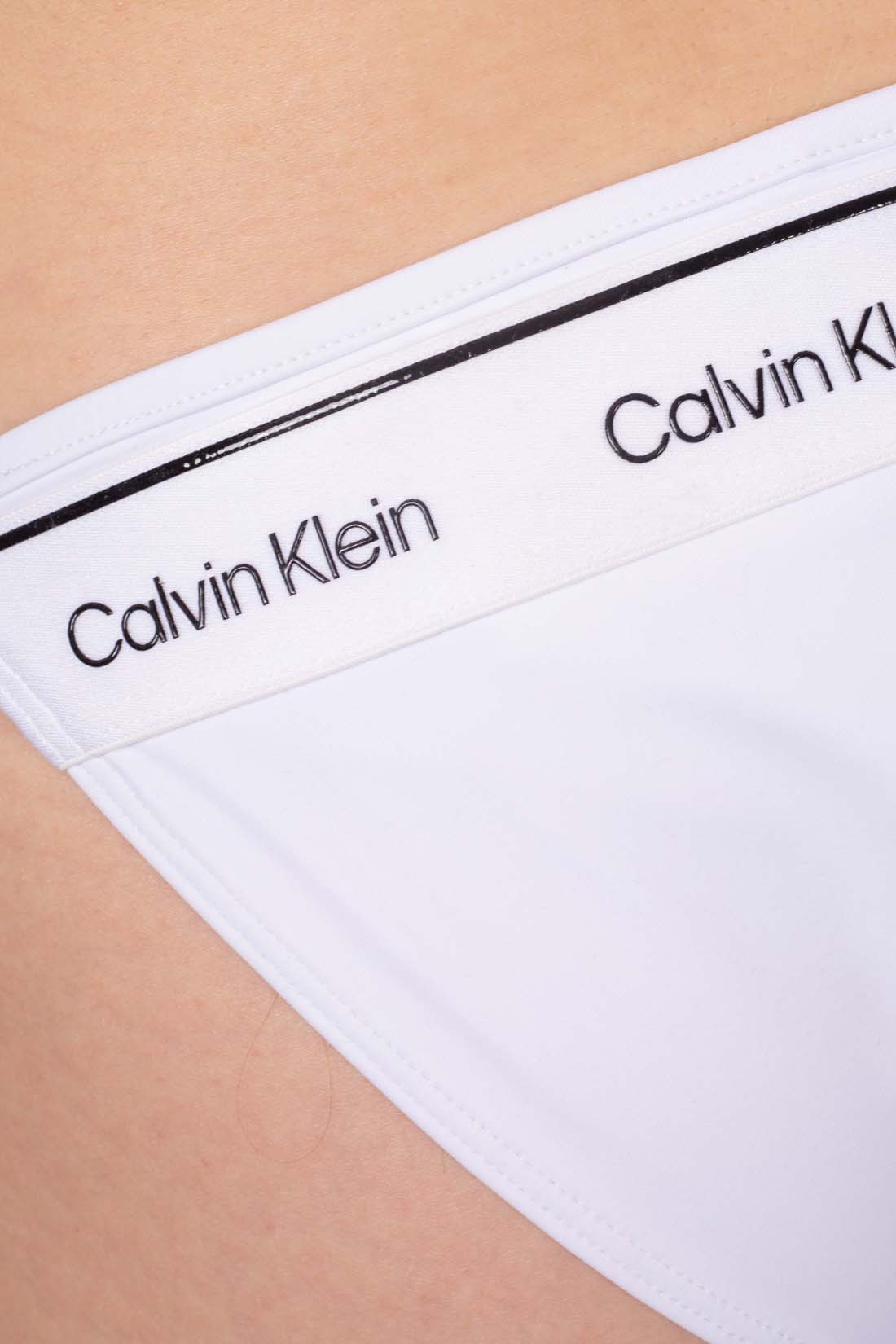 White stretch nylon bikini brief with side tie laces and signature Calvin Klein logo detail — view 25