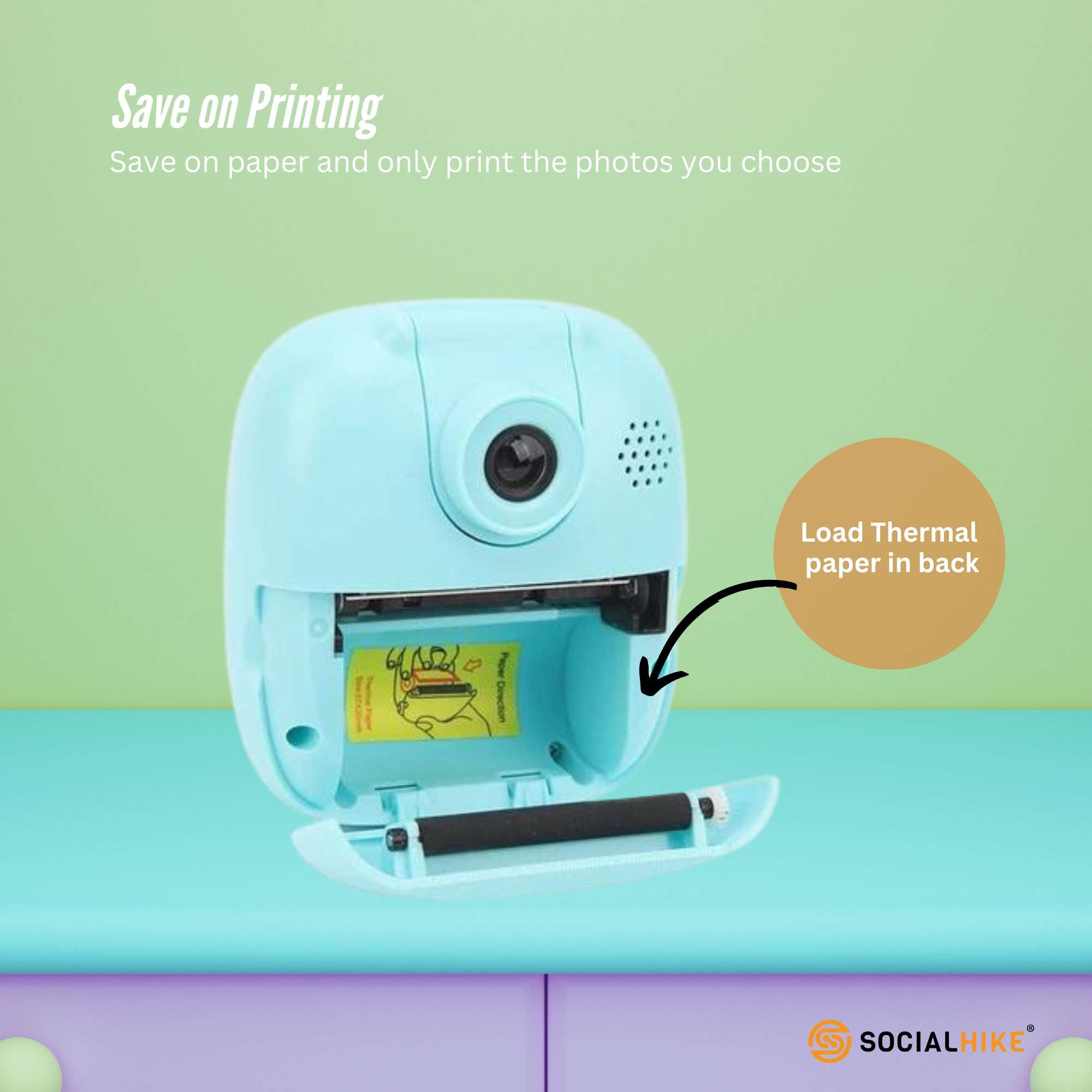 Blue kids instant print camera with dinosaur decal, thermal paper roll, and carry lanyard — view 4