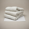 White cotton blend knitted fitted sheet and medical stretcher sheet with ceil blue accents