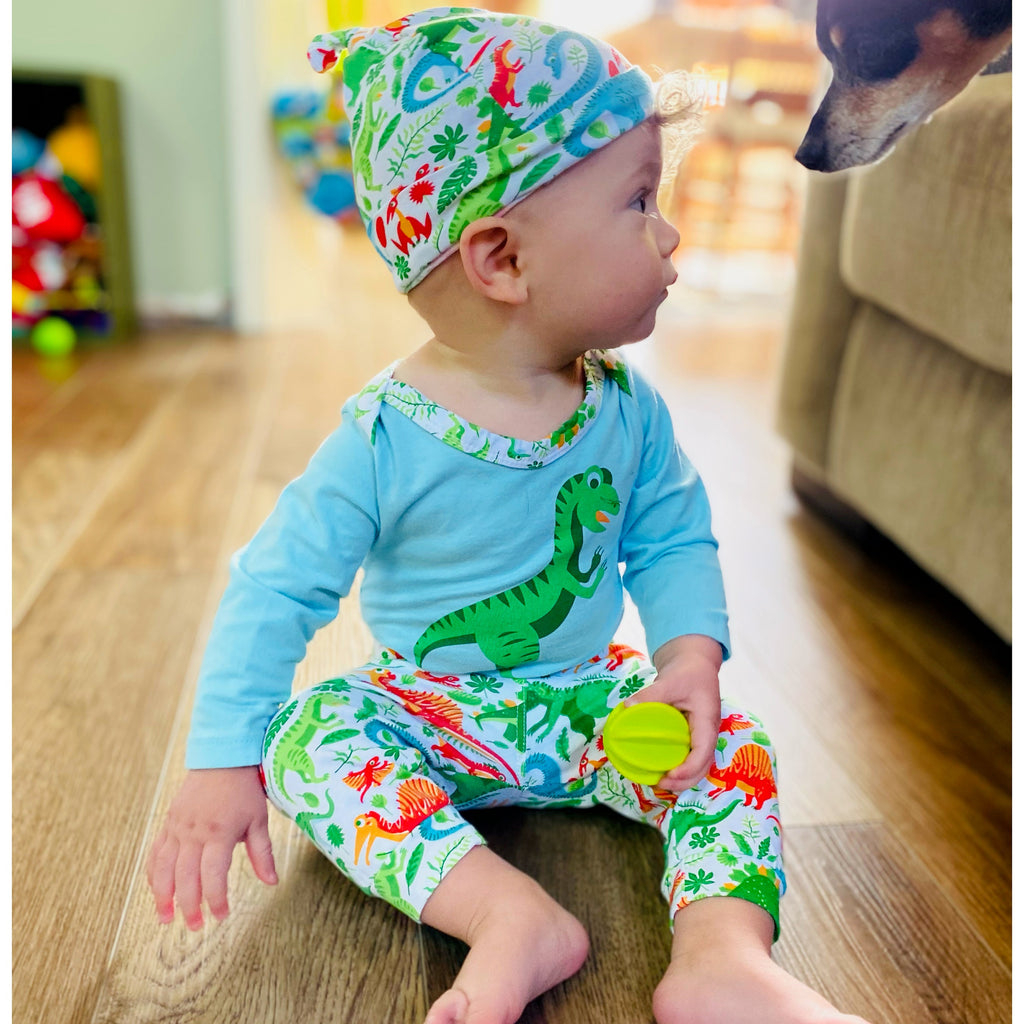3-piece dinosaur baby layette set with green and white bodysuit, jogger pants, and cap — view 3